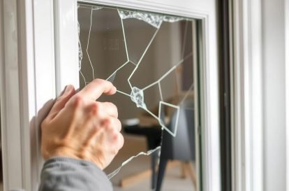 Technician replacing just the glass in a window frame that's in good condition